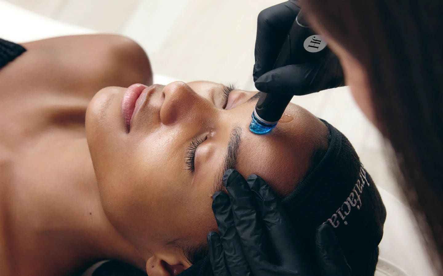 Client relaxing during a treatment consultation at Vale Laser Aesthetics