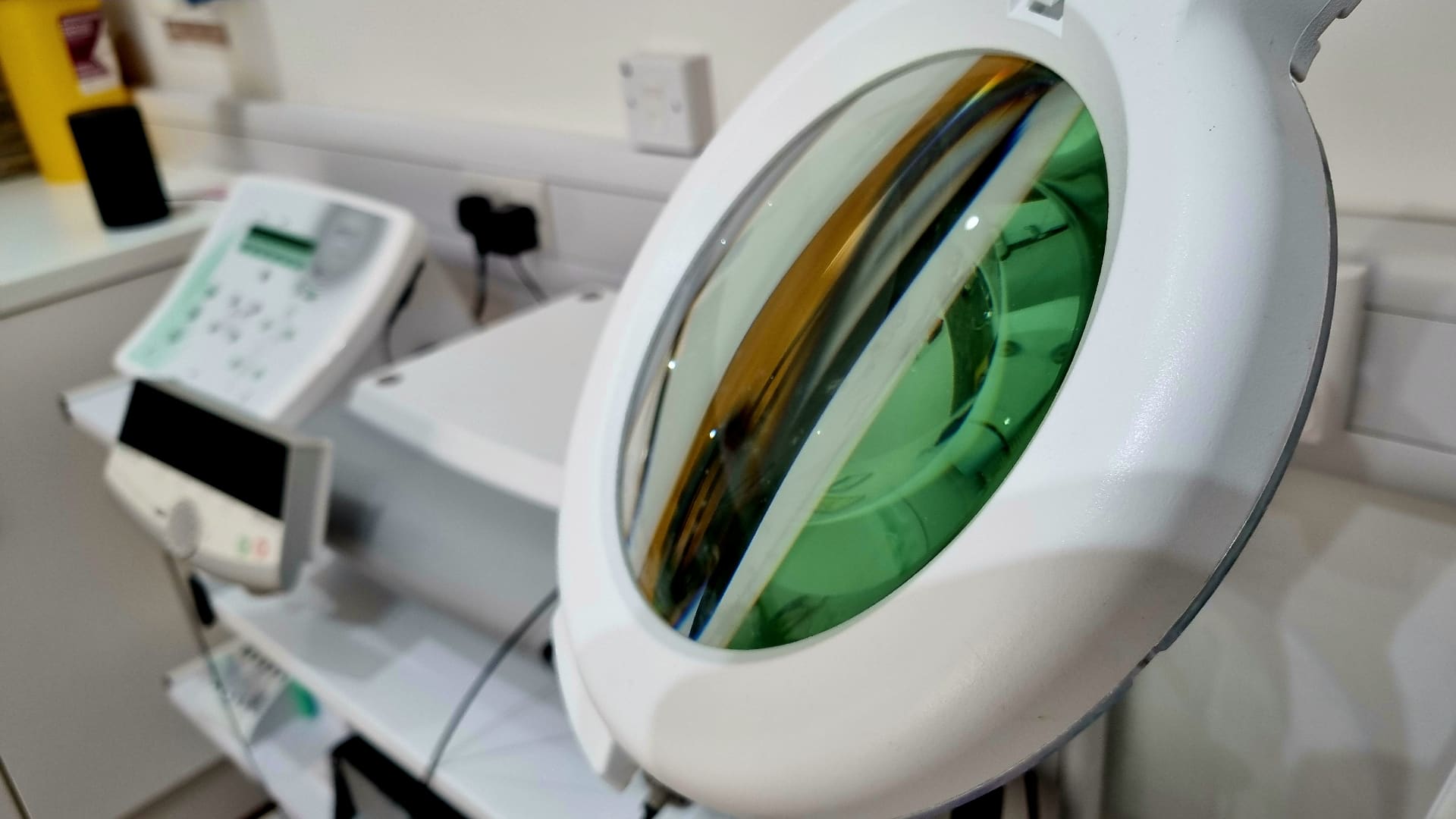 Magnifying lamp and clinical equipment at Vale Laser Aesthetics Pontyclun